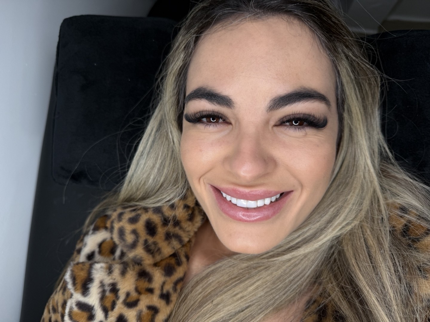 Client smiling after a volume lash set
